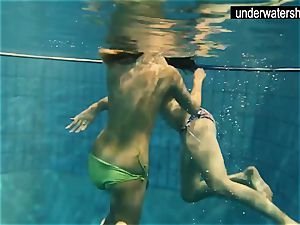 two jaw-dropping amateurs showing their figures off under water